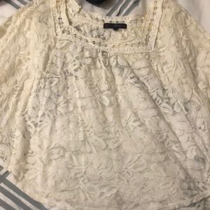 Super cute white see through shirt.